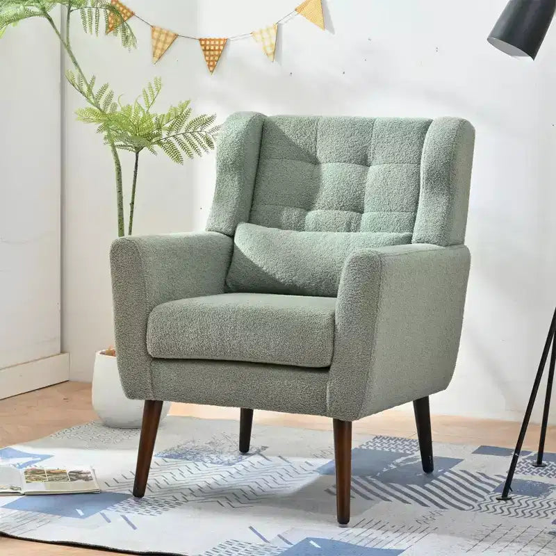 Poltroncina in ciniglia con schienale ergonomico, gambe affusolate in legno e cuscino decorativo, capacità 125 kg