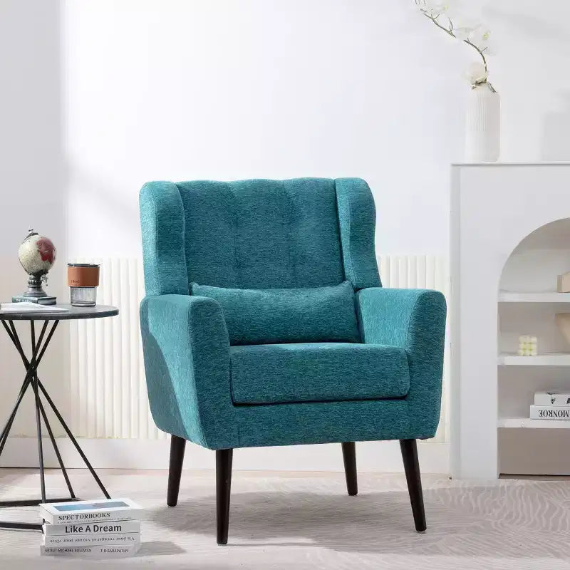 Poltroncina in ciniglia con schienale ergonomico, gambe affusolate in legno e cuscino decorativo, capacità 125 kg