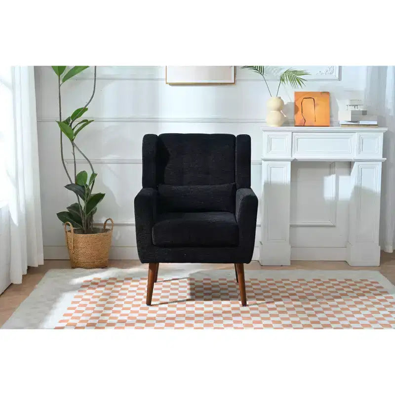 Poltroncina in ciniglia con schienale ergonomico, gambe affusolate in legno e cuscino decorativo, capacità 125 kg