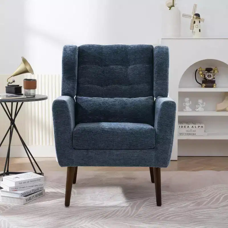 Poltroncina in ciniglia con schienale ergonomico, gambe affusolate in legno e cuscino decorativo, capacità 125 kg