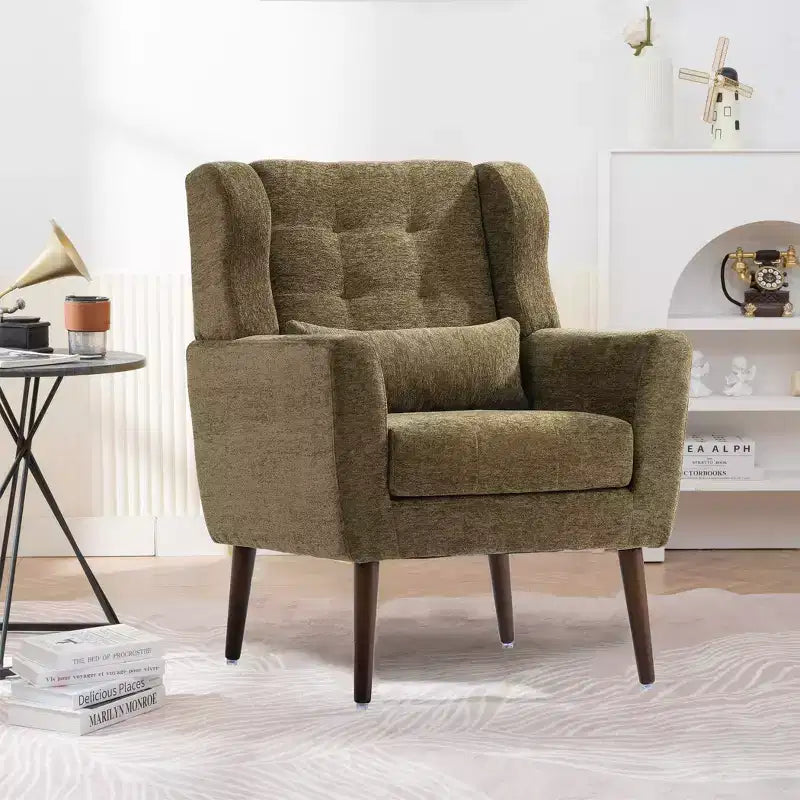 Poltroncina in ciniglia con schienale ergonomico, gambe affusolate in legno e cuscino decorativo, capacità 125 kg
