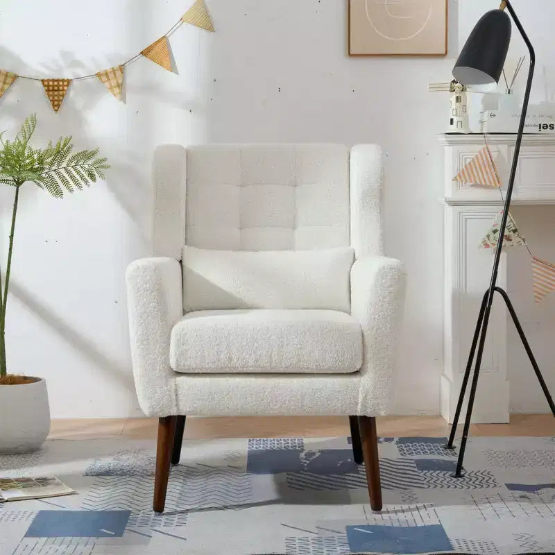 Poltroncina in ciniglia con schienale ergonomico, gambe affusolate in legno e cuscino decorativo, capacità 125 kg